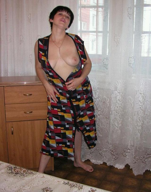 Housewife showed that she had beneath light dressing gown 4 photo