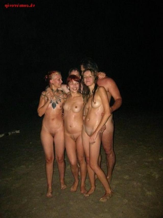 Slender nudists bathing naked on the beach 1 photo