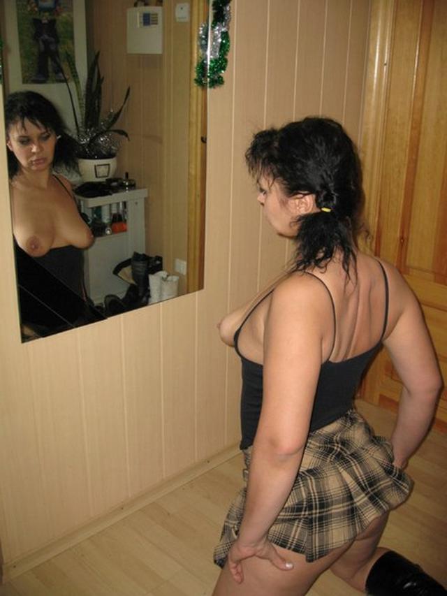 Curvy brunette in checkered skirt showing pussy 15 photo