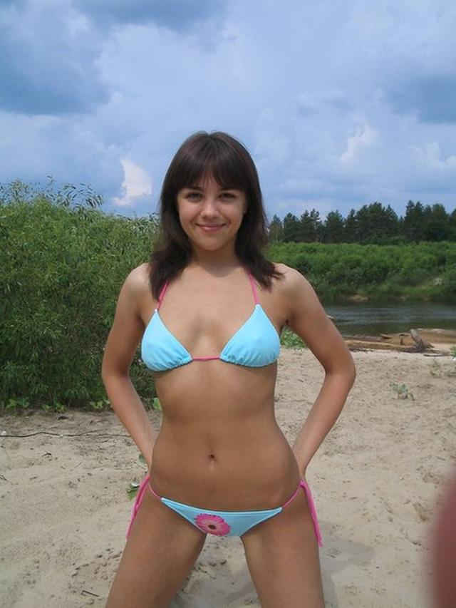 Cute girl sunbathes topless outdoors 1 photo