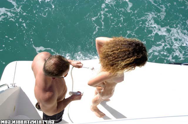 Curly slut agreed to have sex with two strangers on yacht 19 photo