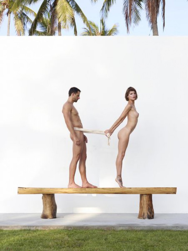Beautiful couple posing nude on the big wooden bench 22 photo