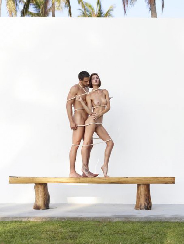 Beautiful couple posing nude on the big wooden bench 19 photo